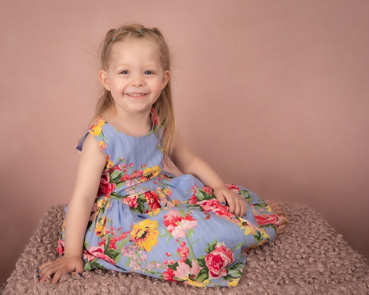 Daycare child portrait in a floral dress